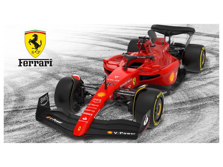 Une voiture de course Ferrari de Formule 1 rouge avec le logo Ferrari et des sponsors comme Shell V-Power et Santander.