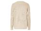 Pull beige en maille avec des détails ajourés.