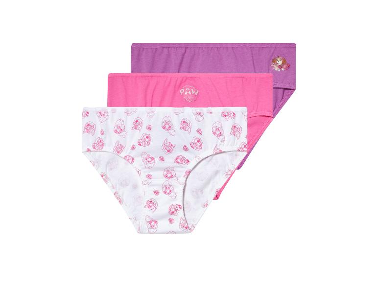 Trois slips pour filles : un blanc à motifs Pat’ Patrouille, un rose et un violet.