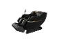 Fauteuil de massage noir avec détails dorés et support de téléphone.