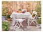 Table et chaises pliantes blanches, ensemble de jardin.