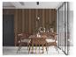 Salle à manger moderne avec table en bois, chaises et lambris mural.