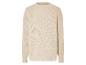 Pull beige avec un motif ajouré.