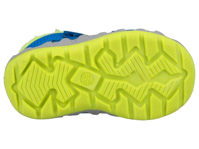 Dessous d'une chaussure d'enfant bleue et jaune avec une semelle antidérapante.