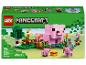 Ensemble Lego Minecraft avec une maison de cochons, des cochons et un loup