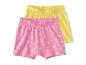 Deux shorts pour filles, un rose avec des soleils et un jaune.