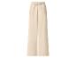 Pantalon large beige avec taille élastique et cordon de serrage.