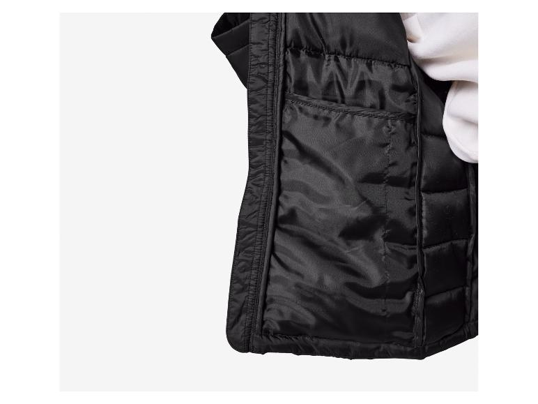 Intérieur d'un gilet noir matelassé.