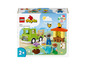 Ensemble LEGO Duplo avec un camion, une ruche et des figurines.