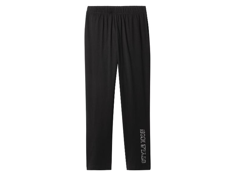 Pantalon noir avec l'inscription 'STYLE ICON' sur la jambe droite.