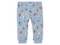 Pantalon bleu pour bébé avec imprimé d'ours, de pingouins et de flocons de neige qui font du ski.