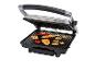 Un grill électrique ouvert avec divers aliments grillés comme du poulet, des légumes et des brochettes.