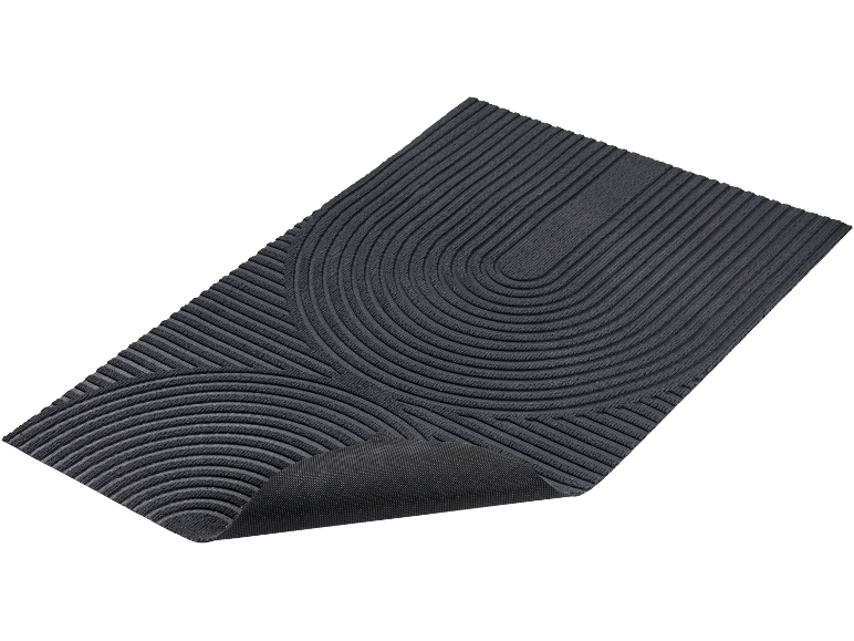 Tapis de bain ou paillasson gris foncé avec un motif de lignes courbes et droites.
