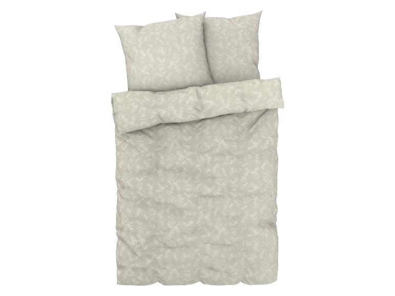 Draps beiges avec des feuilles blanches.