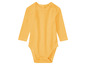 Un body bébé jaune à manches longues.