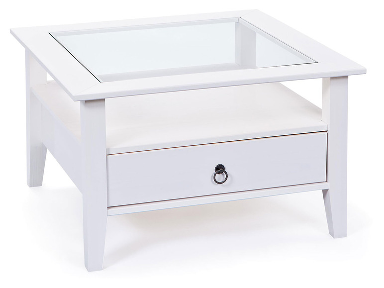 Table basse blanche avec plateau en verre et tiroir.
