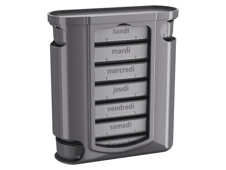Organisateur de pilules hebdomadaire gris avec compartiments étiquetés avec les jours de la semaine en français.