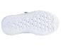Semelle blanche d'une chaussure de sport avec un motif en nid d'abeille.