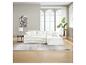Canapé modulaire blanc avec coussins, table d'appoint, lampe et plante en pot dans un salon lumineux.