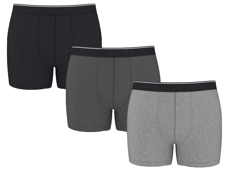 Lot de trois boxers pour hommes en noir, gris foncé et gris clair.