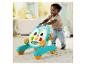 Trotteur Fisher-Price en forme de pingouin avec un enfant apprenant à marcher.