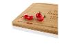 Planche à découper en bambou avec des tomates cerises et l'inscription 'Home Sweet Home'