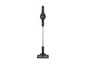 Un aspirateur Grundig noir avec un long manche.
