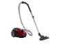 Aspirateur Philips : corps rouge, tube et accessoires noirs.