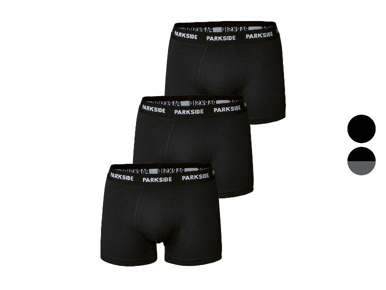 Lot de trois boxers noirs pour hommes avec ceinture blanche.