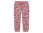 Pantalon de jogging rose avec un imprimé en forme de cœur.