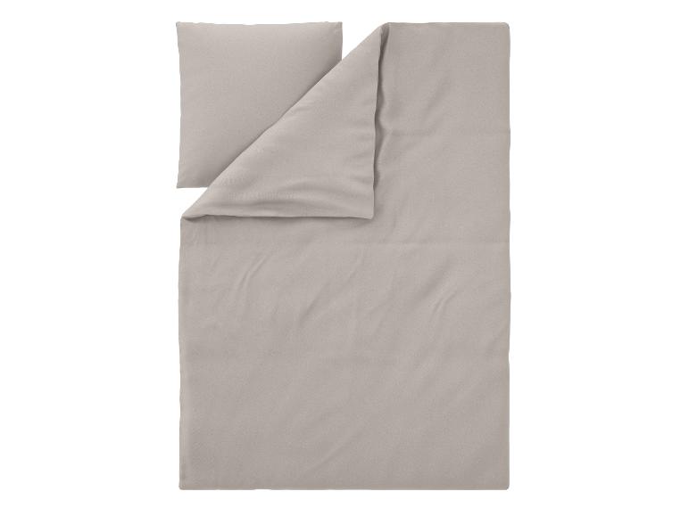 Parure de lit gris clair avec une taie d'oreiller