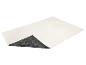 Tapis de bain blanc cassé avec un motif ondulé et un revers antidérapant gris foncé à motif floral.