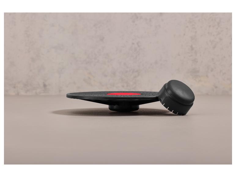 Un disque d'équilibre noir et un poids d'entraînement.