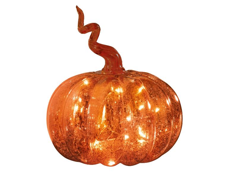 Citrouille en verre orange avec une tige bouclée, éclairée de l'intérieur.