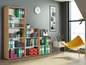 Un bureau avec une bibliothèque, des dossiers, une machine à café et une chaise jaune.