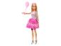 Poupée Barbie en tenue de fête avec ballon rose et sac argenté.