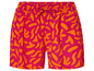 Shorts roses avec un motif floral orange