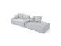Canapé modulaire en velours côtelé gris clair avec coussins et section méridienne.