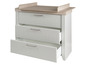 Commode blanche avec trois tiroirs et plan à langer.