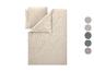 Parure de lit beige clair avec palette de couleurs