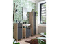 Meubles de salle de bain avec miroir, lavabo et deux armoires dans un environnement tropical.