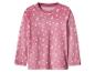 Pyjama en peluche rose avec imprimé étoiles et croissants de lune.