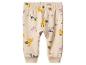 Pantalon bébé beige clair avec imprimé animaux : zèbres, girafes et hippopotames.