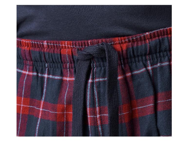 Pantalon noir à carreaux rouge et blanc avec cordon de serrage.