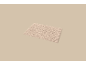 Tapis de bain beige avec un motif ondulé.