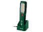 Lampe de travail LED rechargeable dans une station de charge, verte et noire.