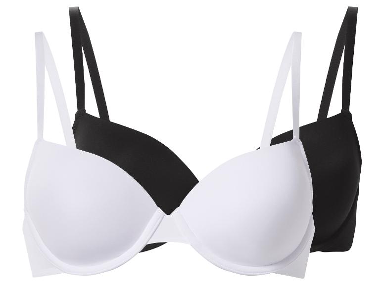 Deux soutiens-gorge : un blanc, un noir, avec bonnets rembourrés et bretelles réglables.