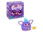 Un jouet en peluche Furby violet avec un peigne.