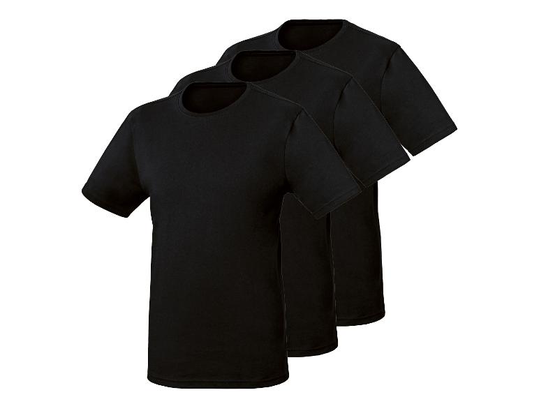 Trois t-shirts noirs à manches courtes, disposés en diagonale