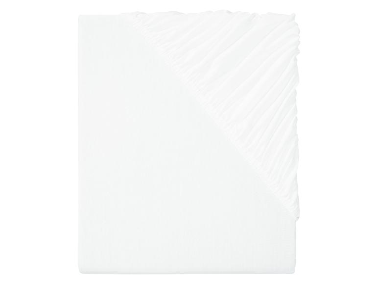 Drap-housse blanc uni.